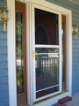 The new storm door, screen mostly down.